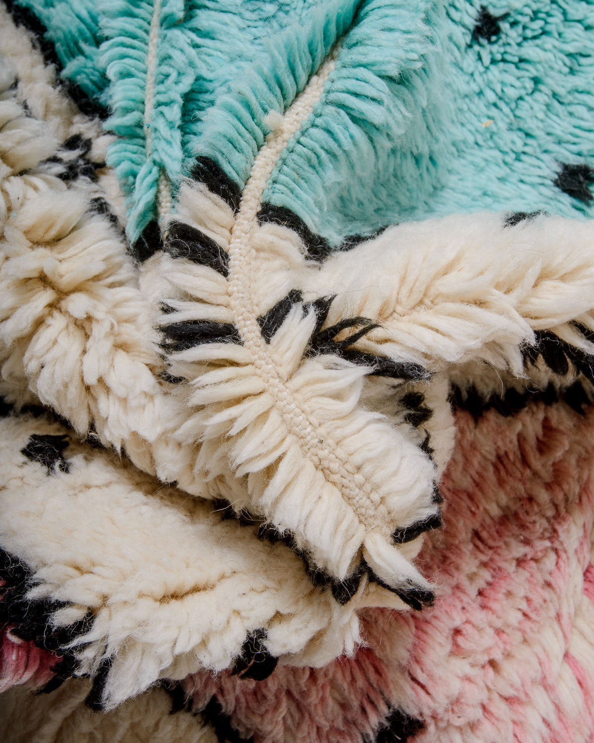Detail of Berberlin finest rug showing fluffy wool pile and dense knots.